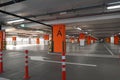 Dubai UAE December 2019 Underground parking which is almost empty. Empty garage in basement of office building. Reinforced