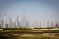 Dubai Downtown skyline landscape with the skyscrapers, Burj Khalifa and Ras al Khor mangrove forests.