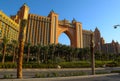 Dubai, UAE - February 14,2022: Atlantis Palm Hotel at the Dubai palm artificial island. Casting a golden glow over the turquoise