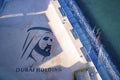 Aerial view of sea with Dubai holding sign on top of building