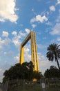 Dubai Frame the golden tower building at sunset. Dubai`s famous modern architecture on a cloudy blue sky background. Royalty Free Stock Photo