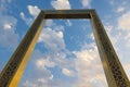 Dubai Frame the golden tower building at sunset. Dubai`s famous modern architecture on a cloudy blue sky background. Royalty Free Stock Photo