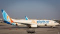 Flydubai low-cost airline Boeing 737-800 NG parked on apron at Dubai International Airport DXB. Royalty Free Stock Photo