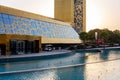 Dubai Frame ornamental golden facade, entry to the building with glossy pools around, Zabeel Park.