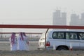 Dubai UAE group of Muslim men wearing traditional dishdash and gutras