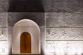 Illuminated entrance doors and facade of white Mosque of Light in Dubai. Royalty Free Stock Photo