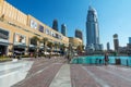 Dubai, UAE - January 2, 2018: Downtown Dubai skyline, view from the Dubai fountain. Modern city cityscape with skyscrapers, sidewa