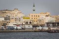 DUBAI, UAE - JANUARY 18, 2017 : Dubai Creek. Small ships and dhows line the Deira side of the creek while abras cross from Bur Du