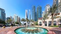 Dubai, UAE, January 11 2023: Fountain in Dubai Marina canal and promenade in beautiful summer day,Dubai,United Arab Emirates Royalty Free Stock Photo