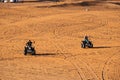 People enjoying quadbike or ATV in Dubai Desert
