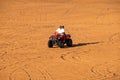 People enjoying quadbike or ATV in Dubai Desert