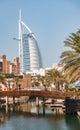 Dubai, UAE, January 5, 2020: Views of the 7-star Burj Al Arab hotel between palm trees from Madinat Jumeirah Royalty Free Stock Photo