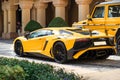 DUBAI, UAE - JANUARY 08, 2019: yellow luxury supercar Lamborghini Aventador Roadster and Gelandewagen. Royalty Free Stock Photo