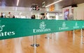 Green ribbon barrier with the Emirates airline logo