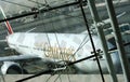 View of Emirates Airlines airplane parking on apron viewed from waiting lounge inside the terminal at Dubai Intenational Airport Royalty Free Stock Photo