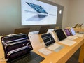 Dubai, UAE - June, 30, 2025: A modern tech store display showcases various Apple devices including laptops and tablets. The Royalty Free Stock Photo