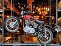 A showroom of vintage classic and premium motor bikes with powerful engine and strong metallic body.
