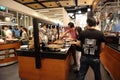 Crowds of people are queueing to pick selections of food in the buffet restaurant. Royalty Free Stock Photo