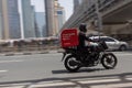 DUBAI, UAE - MAY 12, 2016: motorcycle food delivery service