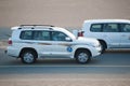 Tourists in offroad safari vehicle during trip to sand dunes