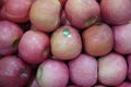 Dubai UAE - November 2019: Bunch of pink apples on boxes in supermarket. Apple put on sale shelves in the supermarket. Fresh ripe Royalty Free Stock Photo