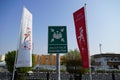 Dubai UAE - November 2019: Emergency assembly point information sign in white paint on green background fixed to a pole to direct