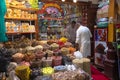 DUBAI, UAE - November 09, 2018: Merchant selling spices to client in Dubai spice souk in Deira district.