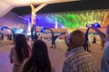 Dubai, UAE - November 28, 2021: People watching dragons performance at night at Expo2020, funny atmosphere. People from Royalty Free Stock Photo