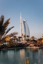 Dubai, UAE - November 04, 2021: The view of the Burj Al Arab hotel from Madinat Jumeirah in Dubai at sunset. Luxury modern Royalty Free Stock Photo