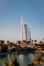 Dubai, UAE - November 04, 2021: The view of the Burj Al Arab hotel from Madinat Jumeirah in Dubai at sunset. Luxury modern Royalty Free Stock Photo