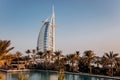 Dubai, UAE - November 04, 2021: The view of the Burj Al Arab hotel from Madinat Jumeirah in Dubai at sunset. Luxury modern Royalty Free Stock Photo