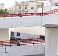 Dubai, UAE - 07.14.2021 People using foot cross bridge to cross the road. Outdoors