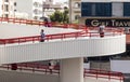 Dubai, UAE - 07.14.2021 People using foot cross bridge to cross the road. Outdoors