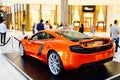 DUBAI, UAE - SEPTEMBER 23, 2012: An orange McLaren sports car showcased inside The Dubai Mall
