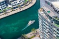 Dubai, UAE 2020: Tourist enjoying ride in motor boats in Dubai marina area. Luxury Yacht can be seen moving in the man made Royalty Free Stock Photo