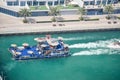 Dubai, UAE 2020: Tourist haviing ride in luxury motor boats in marina area Royalty Free Stock Photo