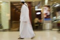 Dubai UAE Two men traditionally dressed in dishdashs and gutras white robes and headdresses. Royalty Free Stock Photo