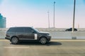 Dubai, UAE, United Arab Emirates - May 28, 2021: Black 2013 Range Rover Vogue car fast mooving on street in Dubai. Land