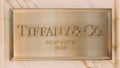 Dubai, UAE, United Arab Emirates - May 28, 2021: Close golden logotype Tiffany Co is an American luxury jewelry and
