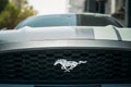 Dubai, UAE, United Arab Emirates - May 25, 2021: Close View Of Logo Logotype Sign Of Ford Mustang on grey hood. Ford Royalty Free Stock Photo