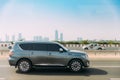 Dubai, UAE, United Arab Emirates - May 28, 2021: Grey nissan Patrol Nismo car fast mooving on street in Dubai. SUV Car