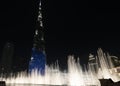 Amazing fountain show in front of the Burj Khalifa skyscraper at night in Dubai. Fountains in front of the Burj Khalifa