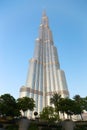 Burj Khalifa tower with arabian palm trees in Dubai, UAE