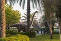 Dubai,UAE - 05.11.2021 -Visitors inspecting austrosaurus replica exhibit at dinosaur park. Outdoors