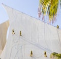 Dubai, UAE - 10.17.2021 Workers cleaning facade of Dubai Creek Golf club with water jet pressure method. industrial