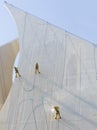 Dubai, UAE - 10.17.2021 Workers cleaning facade of Dubai Creek Golf club with water jet pressure method. industrial