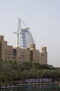 Dubai UAE world famous Burj Al Arab Hotel seen beyond old windtowers Royalty Free Stock Photo