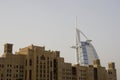 Dubai UAE world famous Burj Al Arab Hotel seen beyond old windtowers Royalty Free Stock Photo