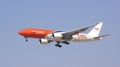 DUBAI, UNITED ARAB EMIRATES - APRIL 1st, 2014: Boeing 777 of TNT Airways on final approach to Dubai Airport DXB