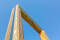 Dubai, United Arab Emirates - August, 2019: Golden Dubai Frame museum from below with clear blue sky in Zabeel Park